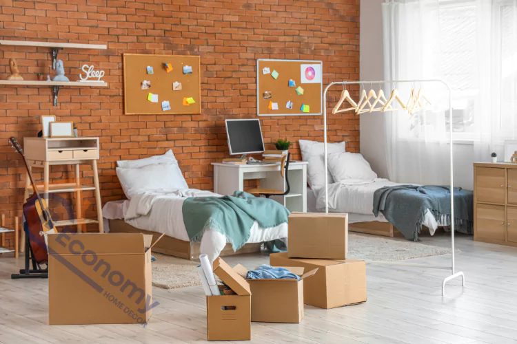 Dorm room decorating ideas featuring a room with exposed red brick walls, two twin beds, a desk with a computer, and cork boards with notes and photos.