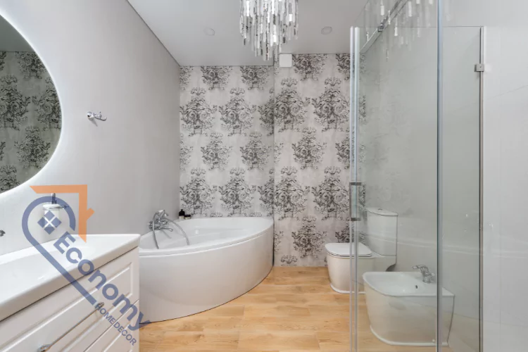 A modern bathroom with a freestanding bathtub, a walk-in shower with a glass partition, and light-colored wood-style tile on the floor.