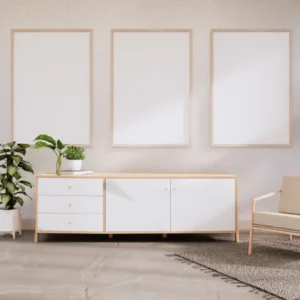 Three natural wood picture frames arranged on white wall above modern credenza
