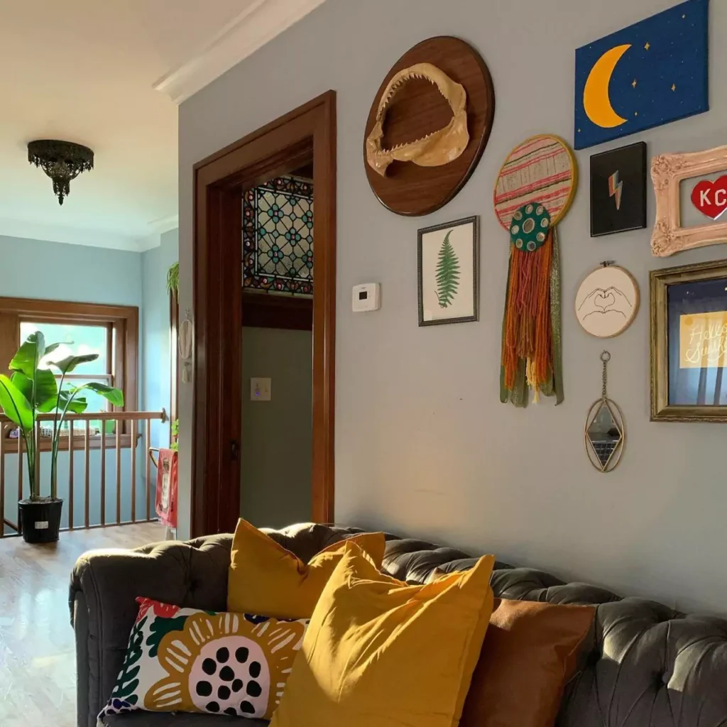 Eclectic, colorful space with layered textiles, plants, global-inspired patterns, rattan furniture, and warm, earthy tones