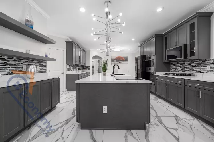 A spacious kitchen with dark gray shaker-style cabinets and a large island, reflecting a modern take on Colonial Style Kitchens.