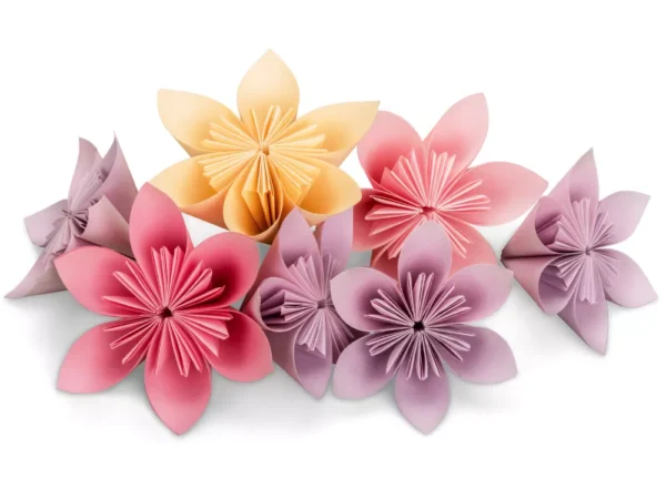 Colorful Modular Origami Paper Decoration A collection of seven handmade paper flowers in various shades of pink, peach/orange, and lavender/purple. The flowers are origami or folded paper creations with multiple petals and detailed centers, displayed on a white background. They look like they could be used for home decor, crafts, or decoration.