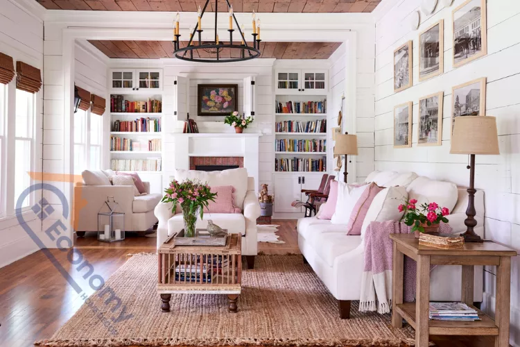 A bright living room demonstrating Cottagecore Decor Ideas, featuring white shiplap walls and a warm wood plank ceiling.