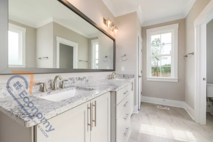 A newly built bathroom vanity with a long, horizontal black-framed mirror extending over a double sink.