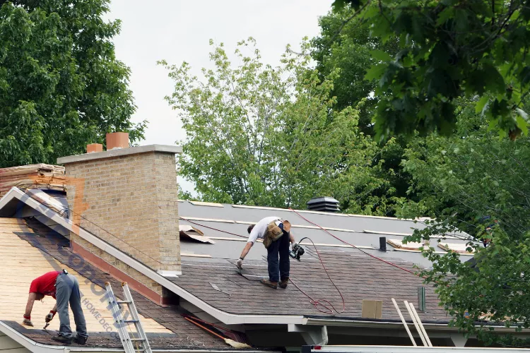 Homeowners working on a DIY roof decoration project using tools and shingles.