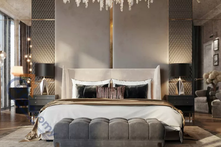 A luxurious and glamorous room featuring a plush, tufted, winged headboard, mirrored side panels, and a cascading crystal chandelier.