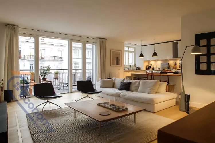 A contemporary open-plan living and dining area with a bright white ceiling, offering minimalist Room Roof Decoration Ideas.
