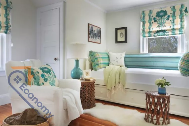 A cozy reading nook or small sitting area featuring teal, turquoise, and aqua decor, including decorative pillows and a teal lamp base.