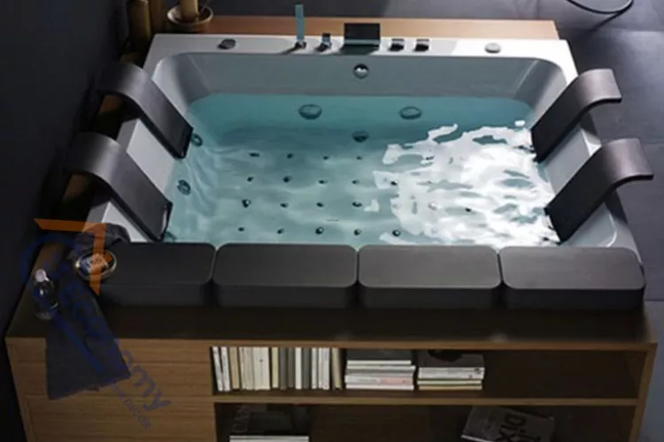 A modern built-in whirlpool tub with dark gray seating or headrest accents, set in a light wood surround with open shelving.