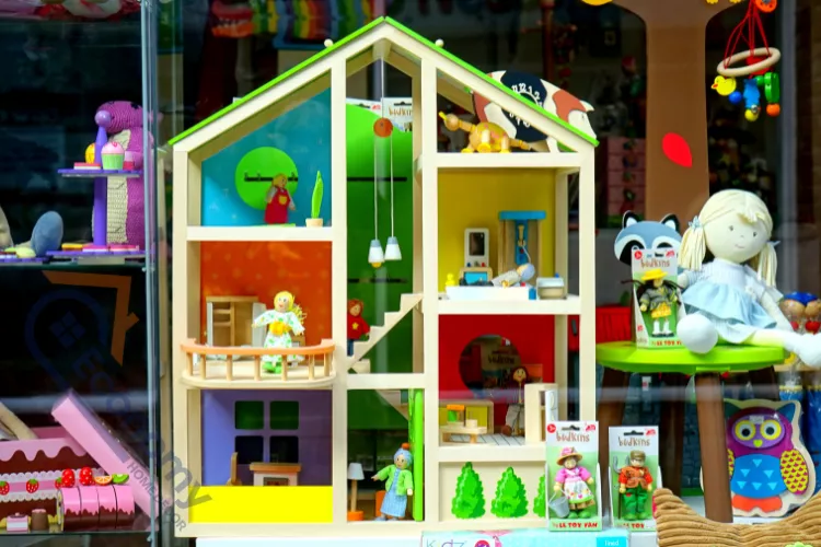 A brightly colored wooden dollhouse with three stories and open front walls, displaying playful dollhouse decor ideas.