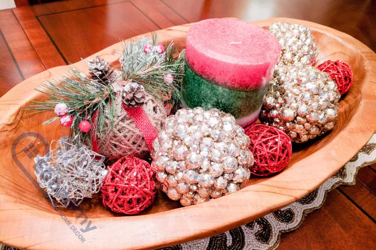 A beautiful centerpiece displaying wooden dough bowl decorating ideas for the Christmas or winter holiday season.