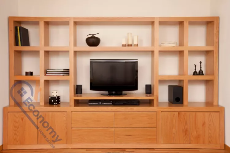 A contemporary media console featuring decorating ideas for entertainment center shelves with books and small sculptures.