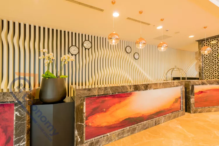 An eclectic living room demonstrating Entertainment Center Decor Ideas with patterned wall art and a mix of vintage accessories.