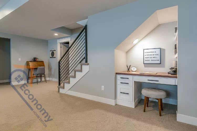 A spacious basement decor idea featuring an open-plan living area with a large gray sectional sofa and wood accents.