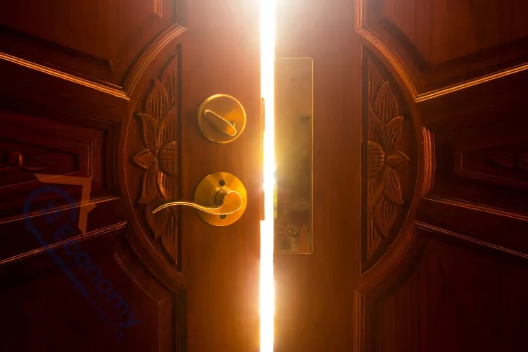 A sophisticated decor for door idea featuring a black front door with sidelights, framed by two large black lanterns.