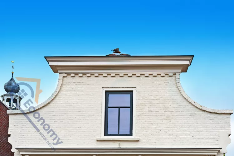 A close-up of a residential roofline featuring multiple nested gable ends decorated with textured shingle siding.