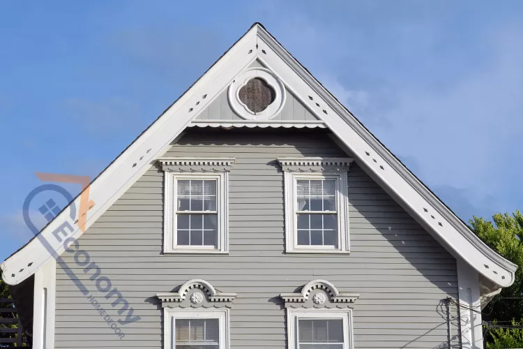 A classic Victorian home featuring decorative gable vent ideas with an octagonal window and detailed trim work.