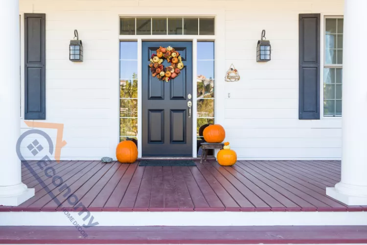 A vibrant front door decorating idea featuring a bright, bold turquoise or teal colored door with glass panels.