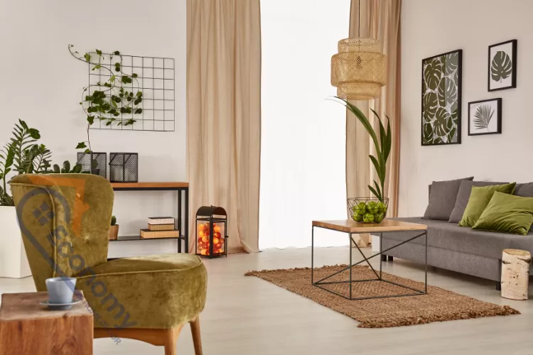 A bright, sunny corner of a small studio flat showcasing how to decorate with light colors and natural textures.