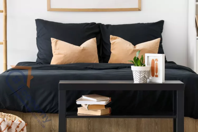 A bedroom showcasing ideas for over the bed wall decor using a symmetrical gallery wall of three framed prints.