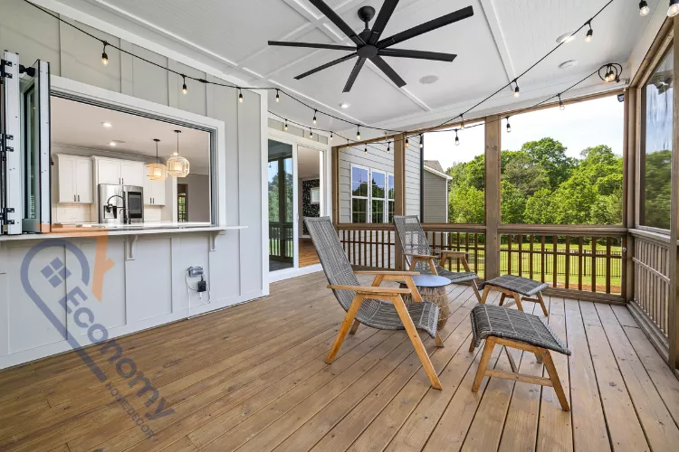 A small screen porch decorating idea showcasing a tight corner with a wooden bench and colorful pillows.
