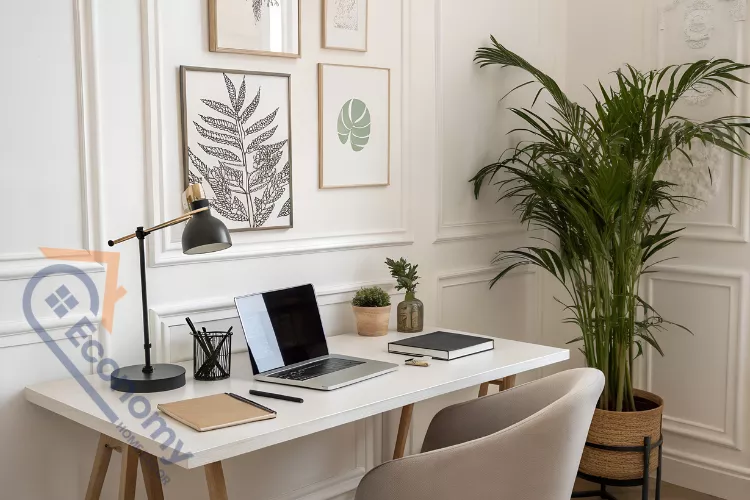 A bright and clean office desk setup demonstrating spring decoration for office ideas with fresh flowers in a white vase.