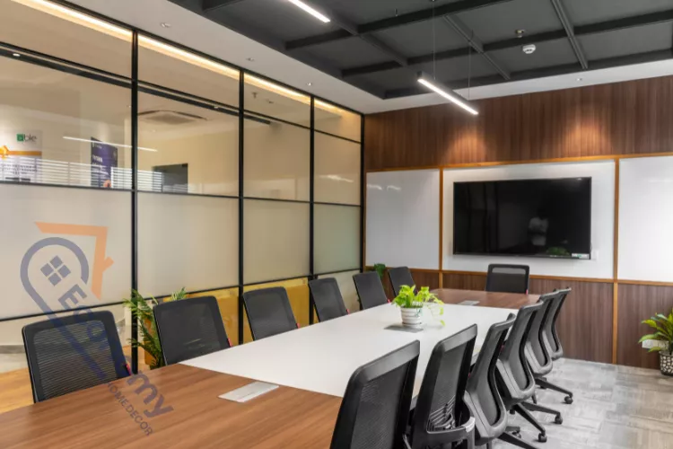 A charming corner of an office showcasing spring decoration ideas with a large, leafy fiddle-leaf fig tree and a decorative ladder.