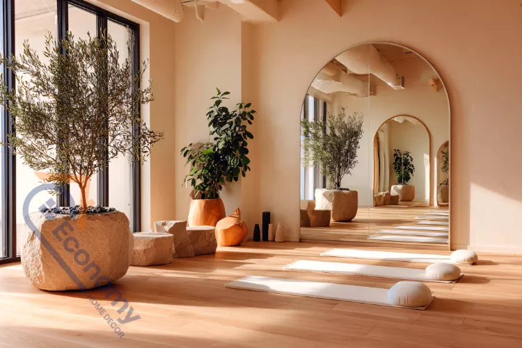 A serene yoga studio wall decor featuring a large, intricate wooden mandala art piece centered above a shelf.