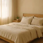 Warm beige bedroom with linen bedding, light wood furniture, and natural textures