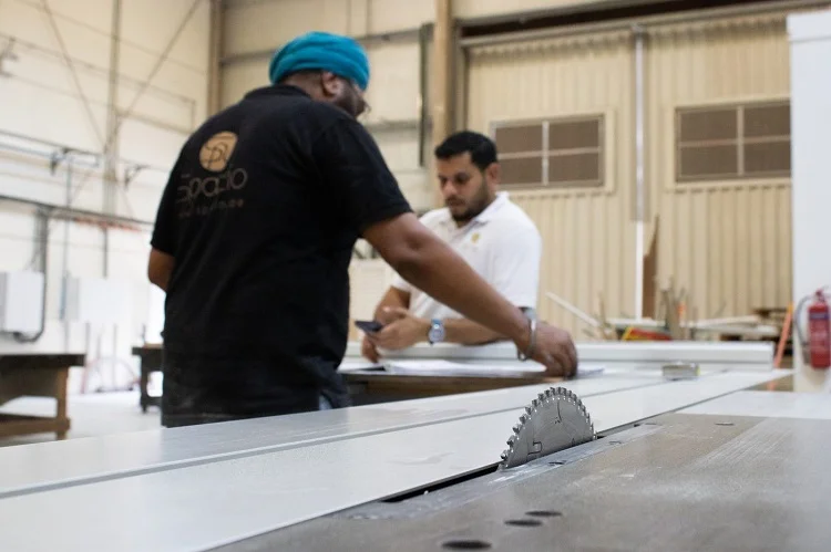 Inside the Spazio manufacturing facility, the same team that designs the joinery oversees its production. When design and making happen in the same operation, the gap between what's drawn and what gets built disappears. | Spazio Interior Decoration LLC