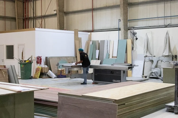 Spazio spray finishing booth where joinery and millwork elements receive their final coatings before installation. Controlling the finish in-house means the color, sheen, and surface quality match exactly what was specified. | Spazio Interior Decoration LLC